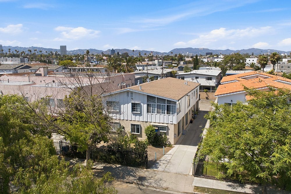Aerial view over Mid-City Los Angeles with the 18th Street fourplex in the foreground